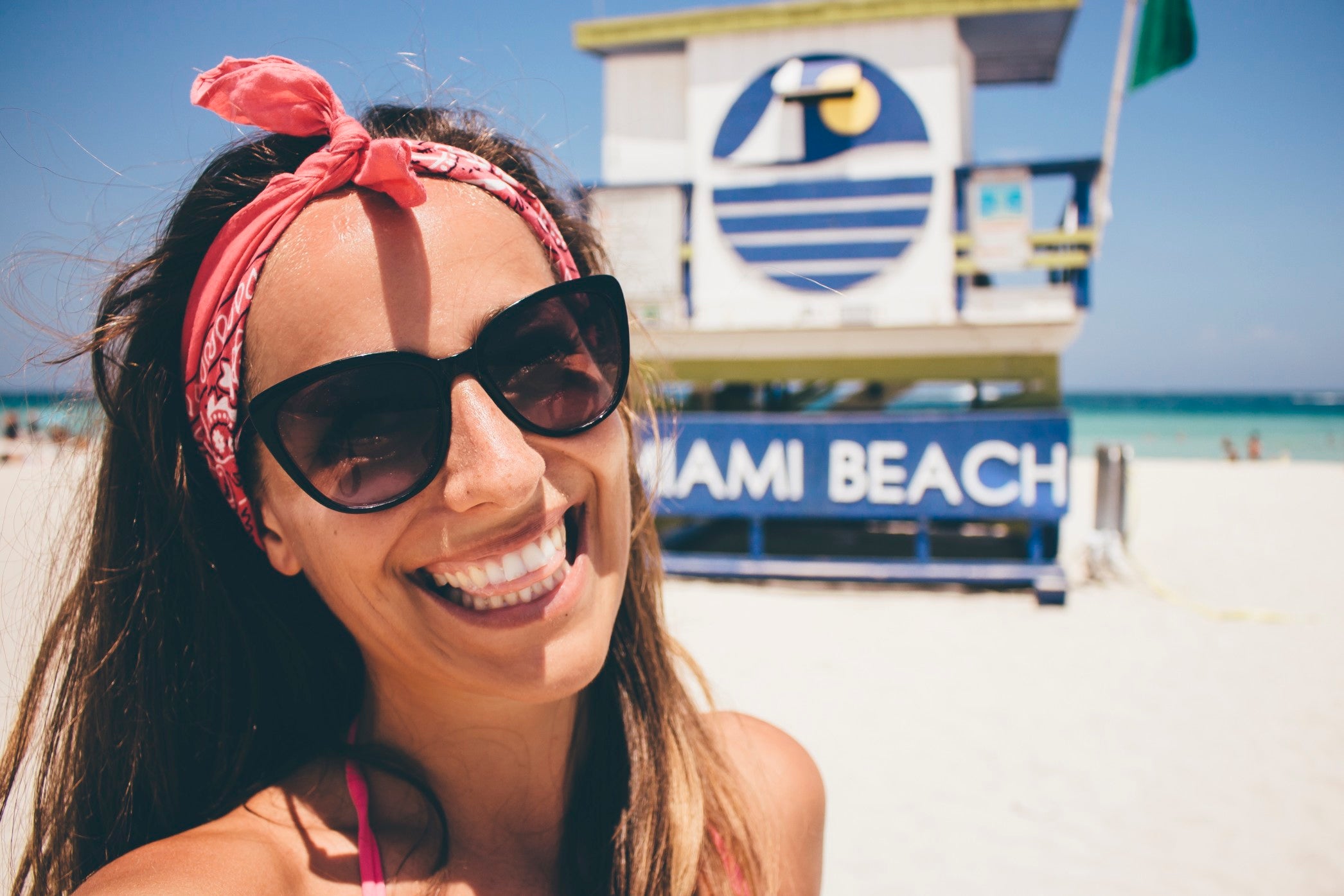 Women smiling on the beach