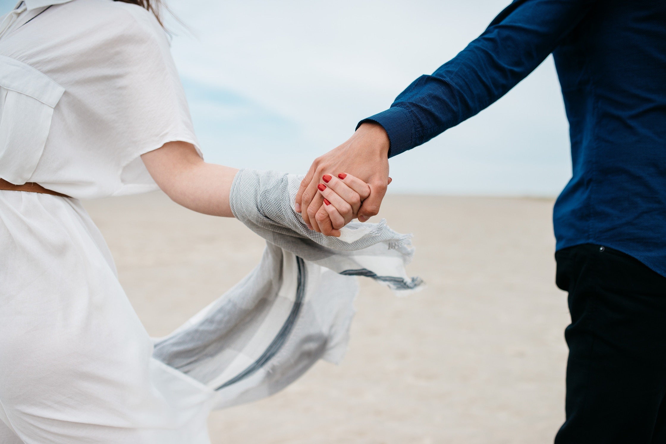 Close up of married couple holding hands