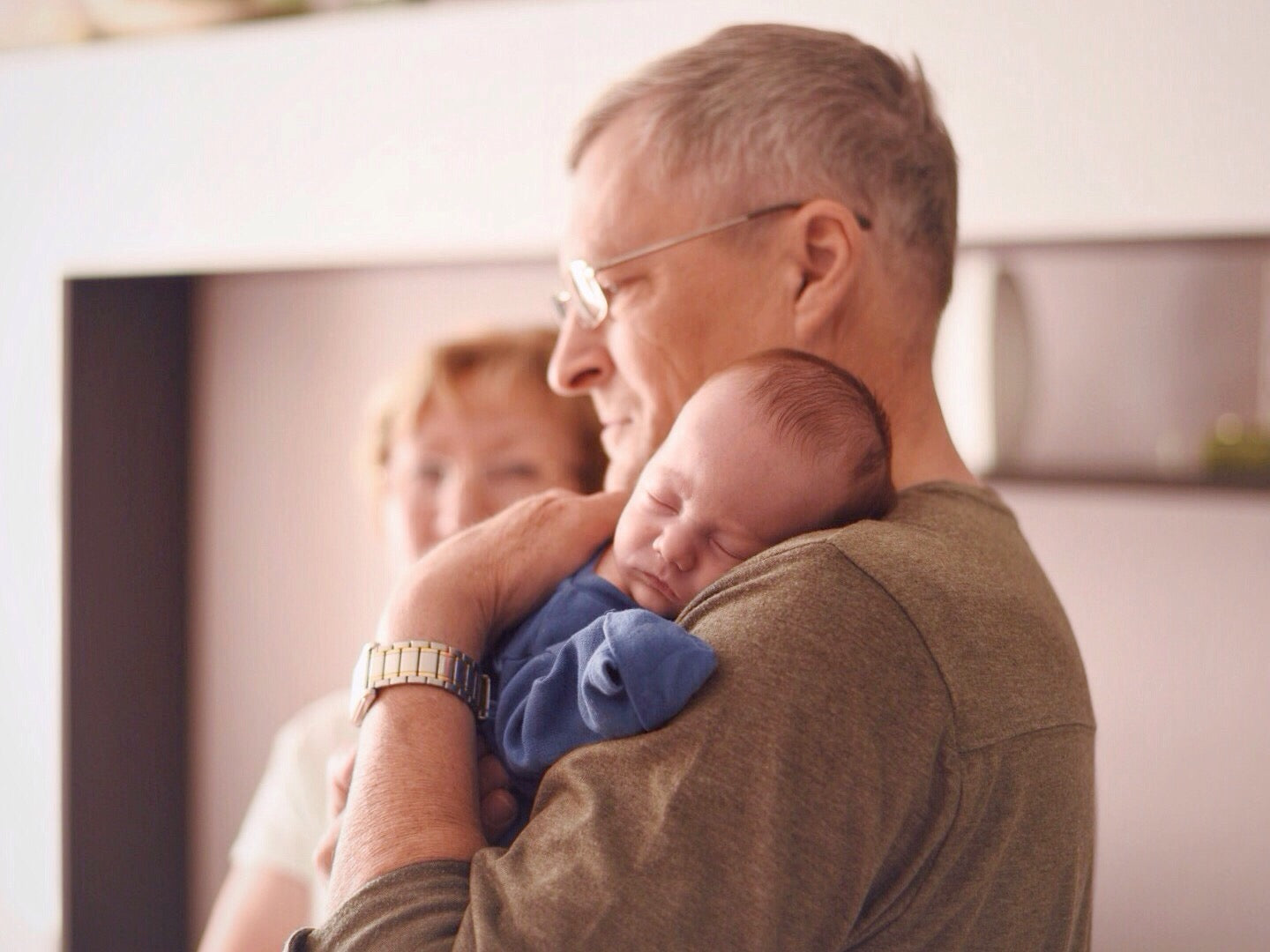Grandparent holding newborn