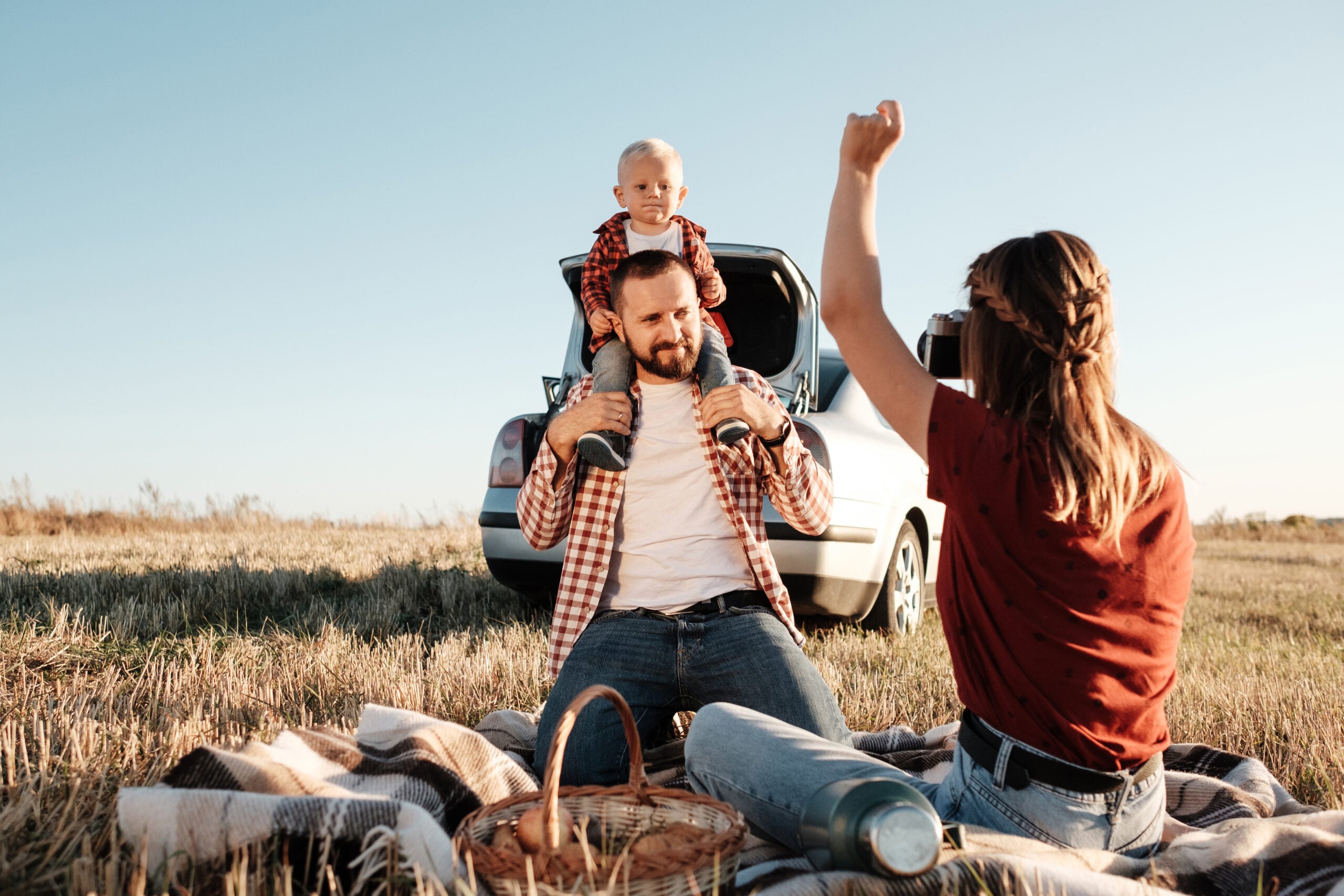 happy,young,family,mom,and,dad,with,their,little,son