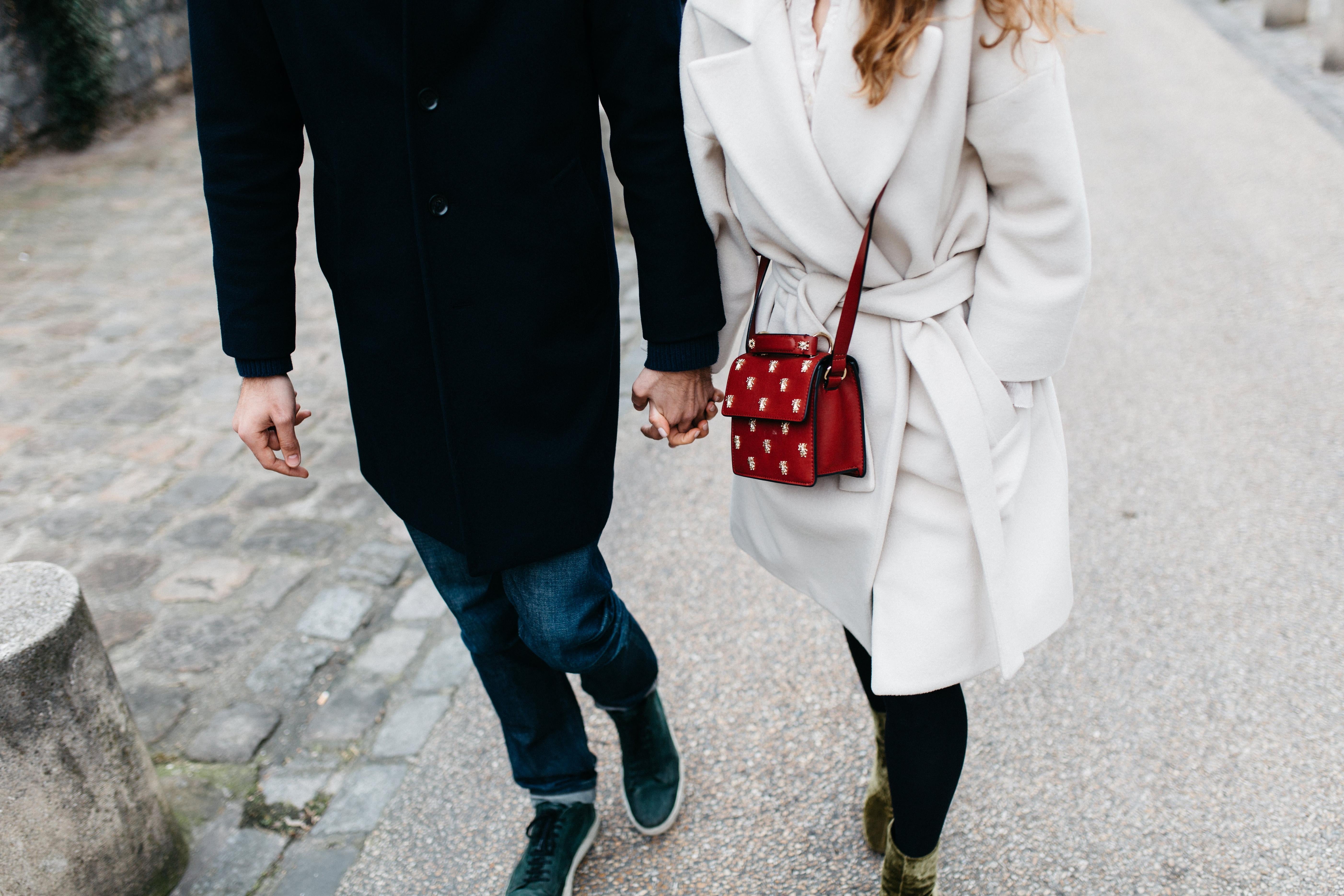 Couple holds hand